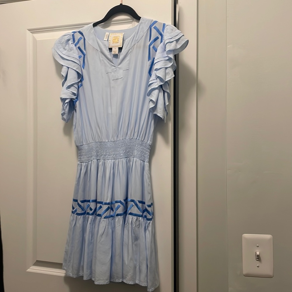 Emily McCarththy baby blue sundress with ocean blue geometric stitching.